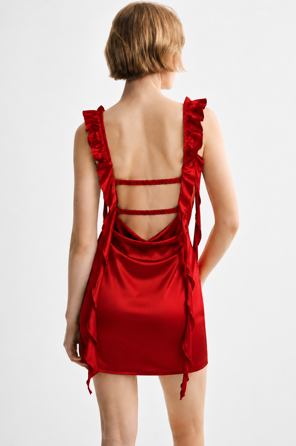 Red satin mini dress with open back and ruffle detail - back view