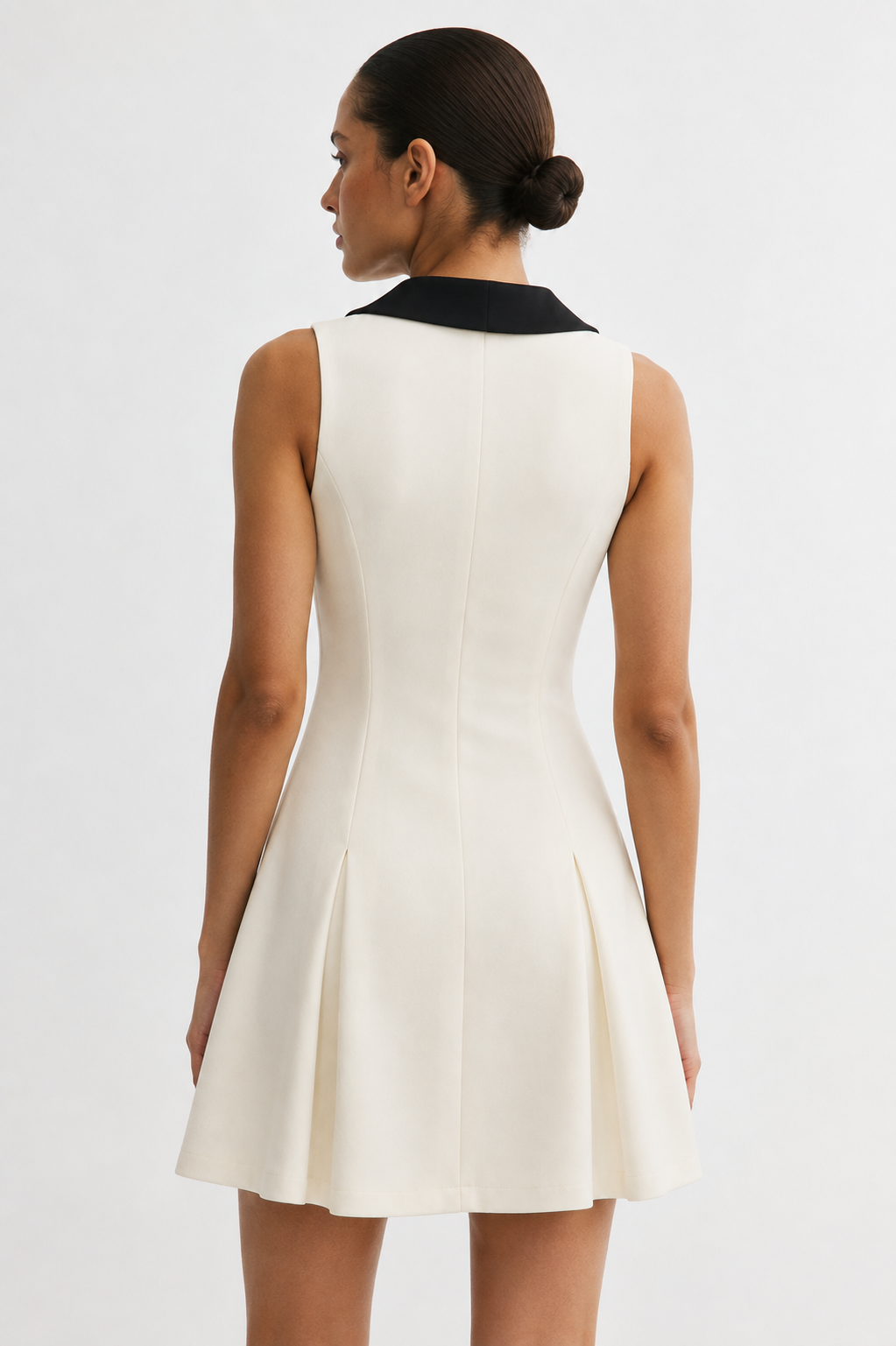 Ivory A-line mini dress with pleated skirt - back view