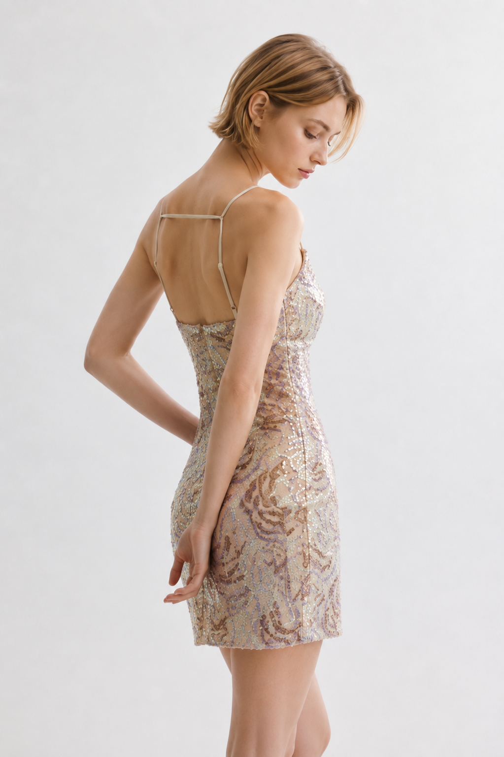 Champagne sequin mini dress with spaghetti straps - side view