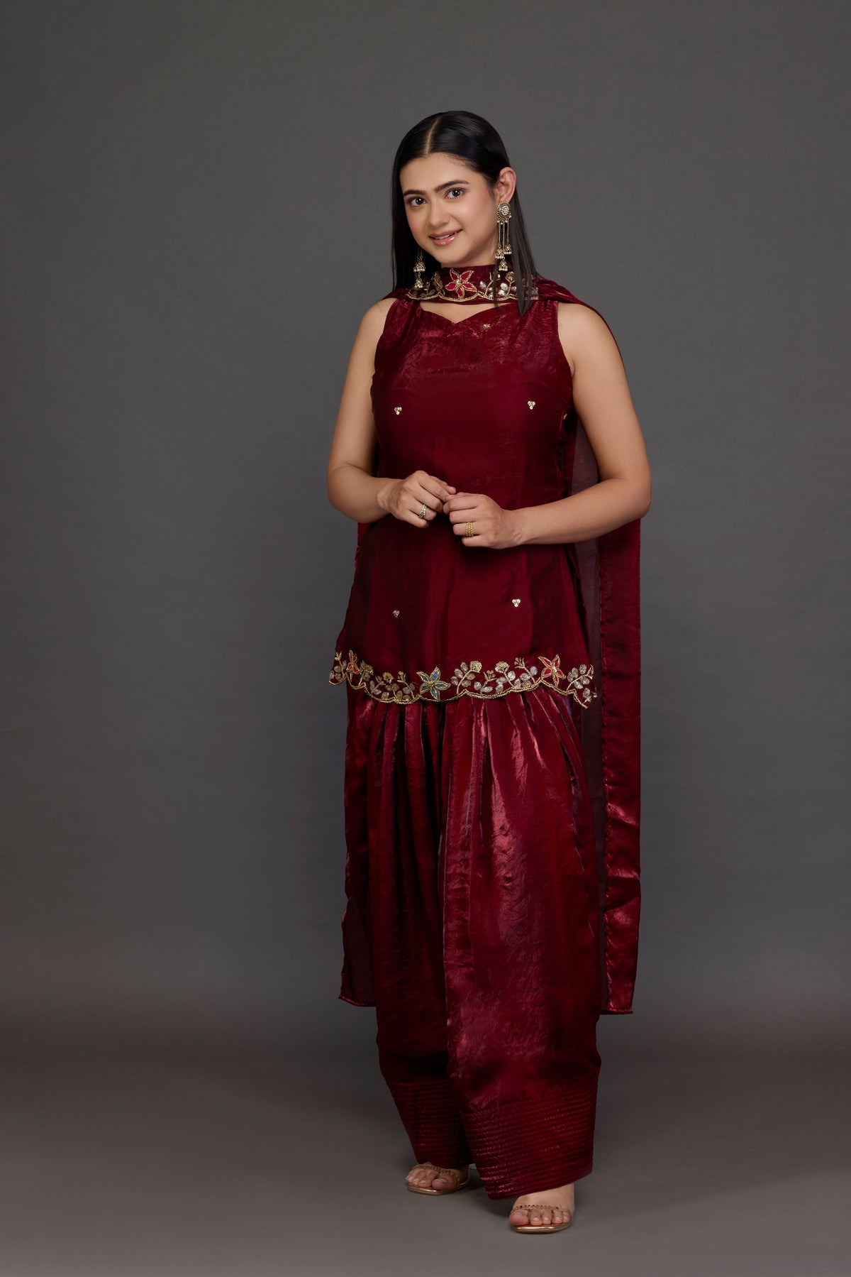Kumkum wine tissue kurta set with embroidered hem, patiala and dupatta - front