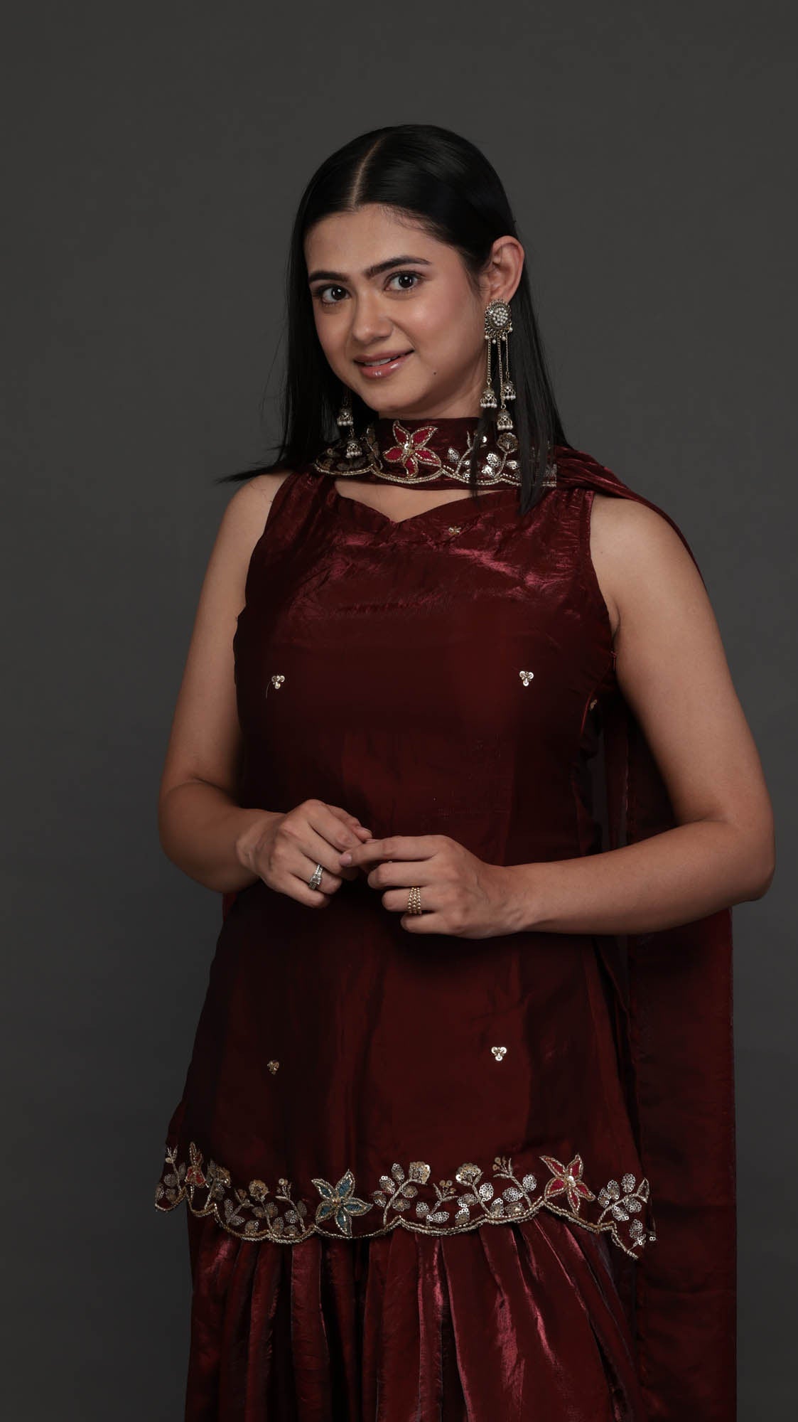 Kumkum wine kurta set - close up of floral zari hem embroidery